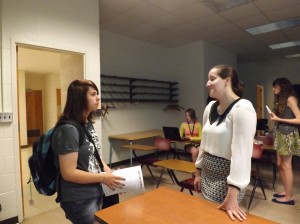 The State news photo editor giving additional advice to a student after her lecture in The Bobby Hawthorne Experience.