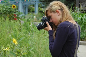 Hannah Andrews lines up for a close up photo in the garden. The students are working on their first project: "Reinterpreting Your World."