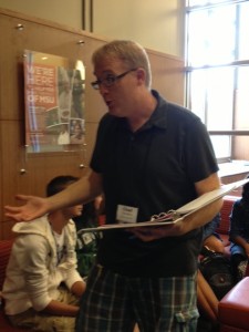 Chad Sanders, interacts with his staff on the afternoon of July 29th. He prepares for many student activites during the week of the MIPA camp, including the tie dye event.