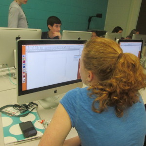 A student beginning her independent newspaper page. 