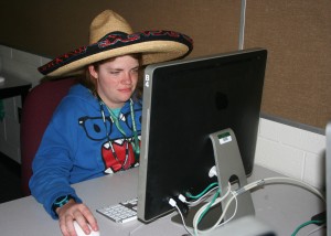 Editing her illustration, Isabelle McGuire from Traverse City Middle School wears her sombrero to Tuesday evening's session. She has worn a different hat everyday at MIPA, ranging from a Eskimo hat to a captain's cap and a sombrero to a panda hat. "You like what you like," McGuire said.