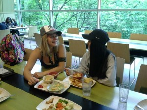 Sierra Harein and Casey Stribbell enjoy their lunch. Both girls wore the classic baseball cap to celebrate hat day. Julianne Bonk/photo